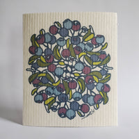 Image shows a swedish dishcloth with a circular blueberry plant blockprint.