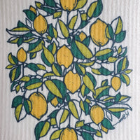 Image shows a closeup of the lemon blockprinted art on a swedish dishcloth