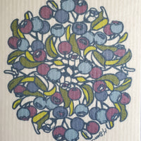 Image shows a closeup of a swedish towel with blueberry art.