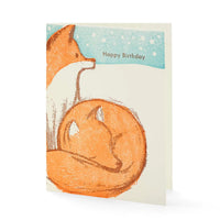 A greeting card features two snuggly foxes. Text behind reads "Happy Birthday."