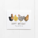 A birthday card featuring watercolor chickens sits against a white background.