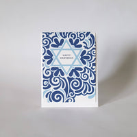 An image of a greeting card. The card features a star of David with "Happy Hannukah" written inside.