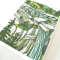 Close up of greeting card with blockprinted nature scene.