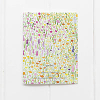 The back of Yardia's floral thank you card shows that the colorful watercolor floral design continues across the back.