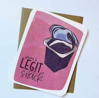 A greeting card has a pudding cup drawing with the words "you're a legit snack" next to it.